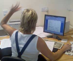 Angela Waving from Timber Sales Desk